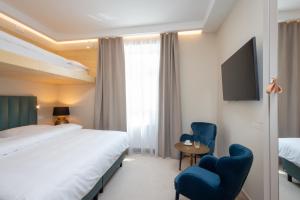Voodi või voodid majutusasutuse PAPPAS hotel&studio toas