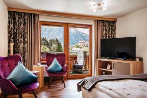 TV a/nebo společenská místnost v ubytování Hotel Leitner