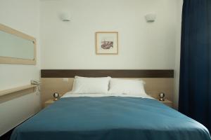 Postel nebo postele na pokoji v ubytování Tuareg Hotel