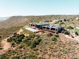 an aerial view of a house in the desert at Khanyisa Mountain Lodge in Robertson