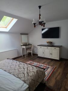 Μια τηλεόραση ή/και κέντρο ψυχαγωγίας στο Pensiunea In Poiana