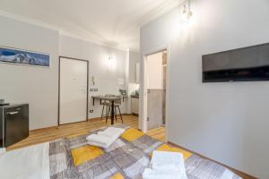 A television and/or entertainment centre at MM Pozzo Strada Mini Subway Studio