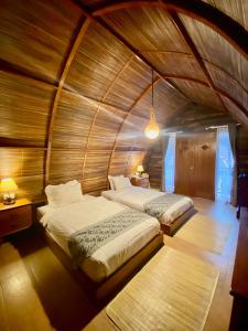 Postel nebo postele na pokoji v ubytování Khanaya Hotel Borobudur