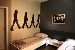 Postel nebo postele na pokoji v ubytování Rock Rooms Pula