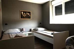 Postel nebo postele na pokoji v ubytování Rock Rooms Pula