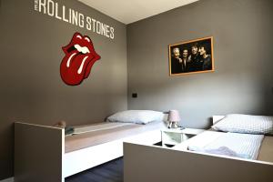 Postel nebo postele na pokoji v ubytování Rock Rooms Pula