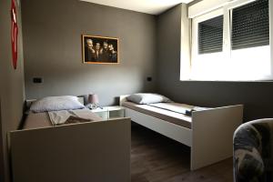 Postel nebo postele na pokoji v ubytování Rock Rooms Pula