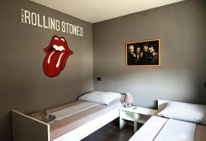 Postel nebo postele na pokoji v ubytování Rock Rooms Pula