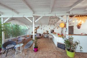 a patio with chairs and tables and a bar at LaWanda9 in Vama Veche +52 photos