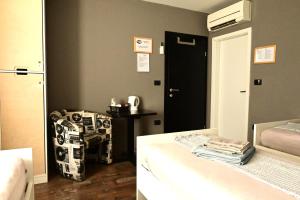 Postel nebo postele na pokoji v ubytování Rock Rooms Pula