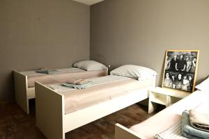 Postel nebo postele na pokoji v ubytování Rock Rooms Pula