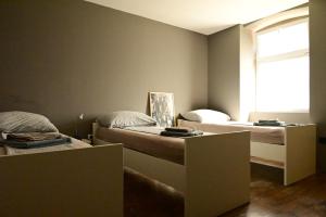 Postel nebo postele na pokoji v ubytování Rock Rooms Pula
