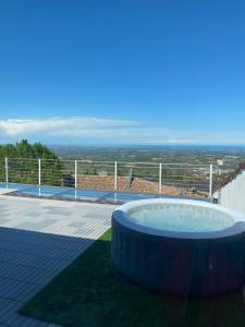 a hot tub sitting on top of a patio at San Marino Skyline - Suite Olimpio in San Marino