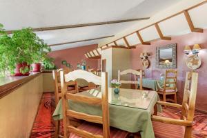 a room with a table and chairs in a room at Best Western Mission Inn in Las Cruces