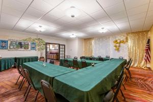 a conference room with a table and chairs in it at Best Western Mission Inn in Las Cruces +30 photos