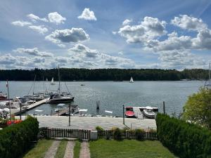 a view of a marina with boats in the water at Pensjonat Monika in Mikołajki