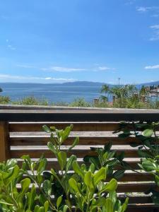 a view of the ocean from the balcony of a house at Apartments Villa Dinka in Opatija