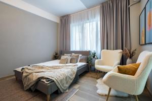 Postel nebo postele na pokoji v ubytování Old Town - Victoriei 25 - UrbanNest Bucharest