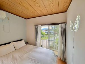 Voodi või voodid majutusasutuse Nest Togari Onsen toas