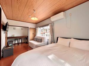 Voodi või voodid majutusasutuse Nest Togari Onsen toas