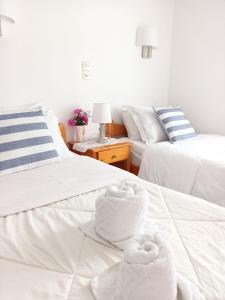 Postel nebo postele na pokoji v ubytování Massouri Rooms