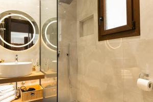 a bathroom with a sink and a shower at Casa Evanti in Syvota +56 photos