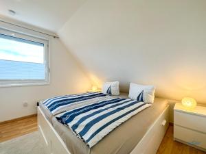 Postel nebo postele na pokoji v ubytování Ferienhaus Seepferdchen Duhnen