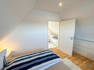 Postel nebo postele na pokoji v ubytování Ferienhaus Seepferdchen Duhnen