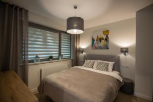 Postel nebo postele na pokoji v ubytování Apartview Bukowa III by Rent like home