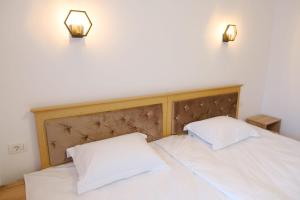 Voodi või voodid majutusasutuse Hotel Parc Geoagiu Bai toas