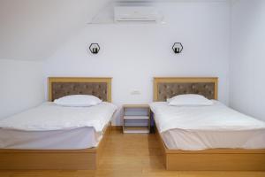 Voodi või voodid majutusasutuse Hotel Parc Geoagiu Bai toas