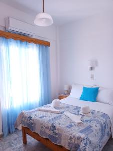 Postel nebo postele na pokoji v ubytování Massouri Rooms