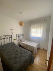 Posteľ alebo postele v izbe v ubytovaní Acogedor apartamento en el paraiso