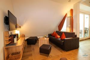 TV a/nebo společenská místnost v ubytování Residenz Hohe Lith Wohnung 28