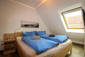Postel nebo postele na pokoji v ubytování Residenz Hohe Lith Wohnung 28 + 16 fotografií