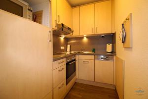 Kuchyň nebo kuchyňský kout v ubytování Residenz Hohe Lith Wohnung 28