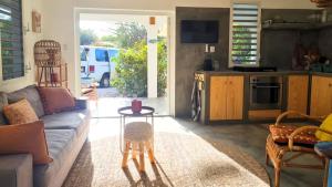 a living room with a couch and a table at 12 Casa Hermanito in Kralendijk