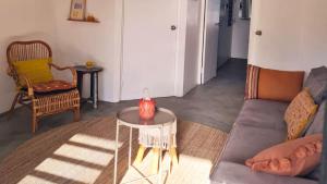 a living room with a couch and a table at 12 Casa Hermanito in Kralendijk