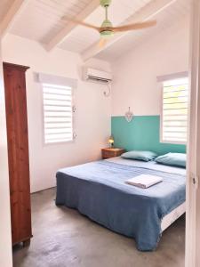 Ένα ή περισσότερα κρεβάτια σε δωμάτιο στο 12 Casa Hermanito