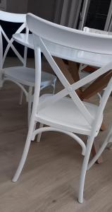 a white chair sitting next to two other chairs at Loano Casa Archè villa indipendente con giardino in Loano