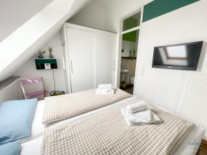 เตียงในห้องที่ Residenz Hohe Lith Wohnung 34 Haus 3 +20 ภาพ
