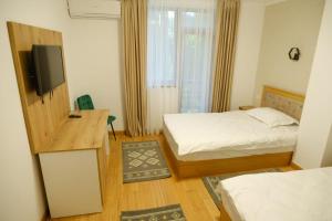 Voodi või voodid majutusasutuse Hotel Parc Geoagiu Bai toas