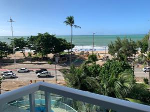 a view of the beach from the balcony of a condo at FLAT HOTEL BEIRA MAR AV BOA VIAGEM Recife in Recife
