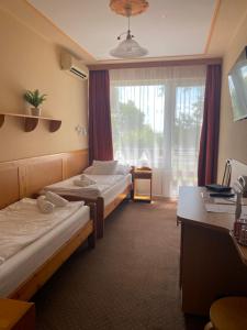 Postel nebo postele na pokoji v ubytování Nereus Park Hotel