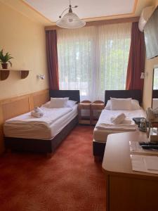 Posteľ alebo postele v izbe v ubytovaní Nereus Park Hotel