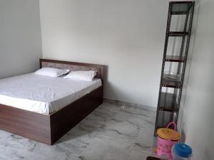Voodi või voodid majutusasutuse Raghubir Nikunj Homestay toas