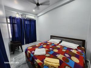 Voodi või voodid majutusasutuse Raghubir Nikunj Homestay toas