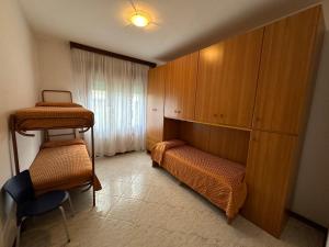 Postel nebo postele na pokoji v ubytování Ca' Bosega - Agenzia Cocal