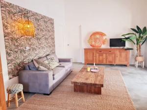 a living room with a couch and a coffee table at 13 Palm Tree in Kralendijk
