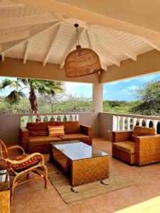 a living room with a couch and a table at 13 Palm Tree in Kralendijk